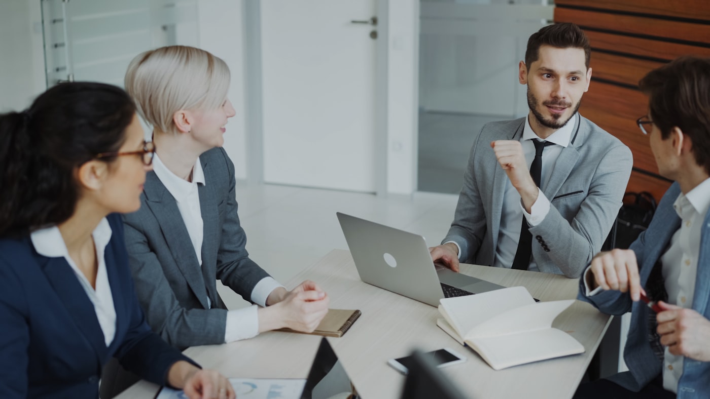 Consultants collaborating around a table